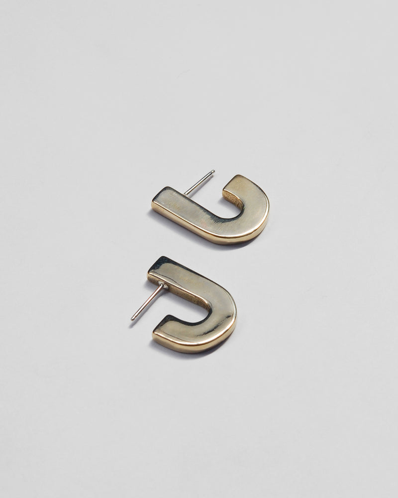 Juxta Earrings in Brass