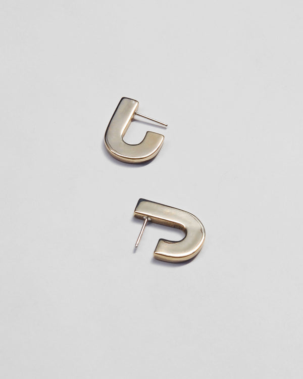 Juxta Earrings in Brass